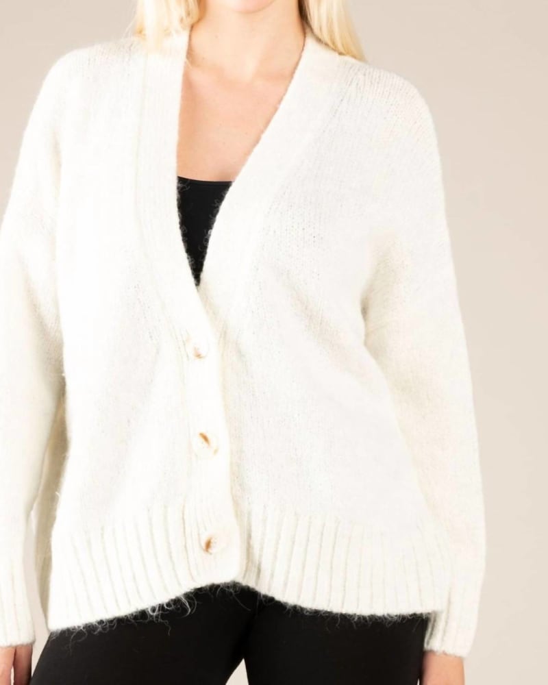 Front of a model wearing a size L Loose Fit V-Neck Cardigan in White in White by APRICOT. | dia_product_style_image_id:326824